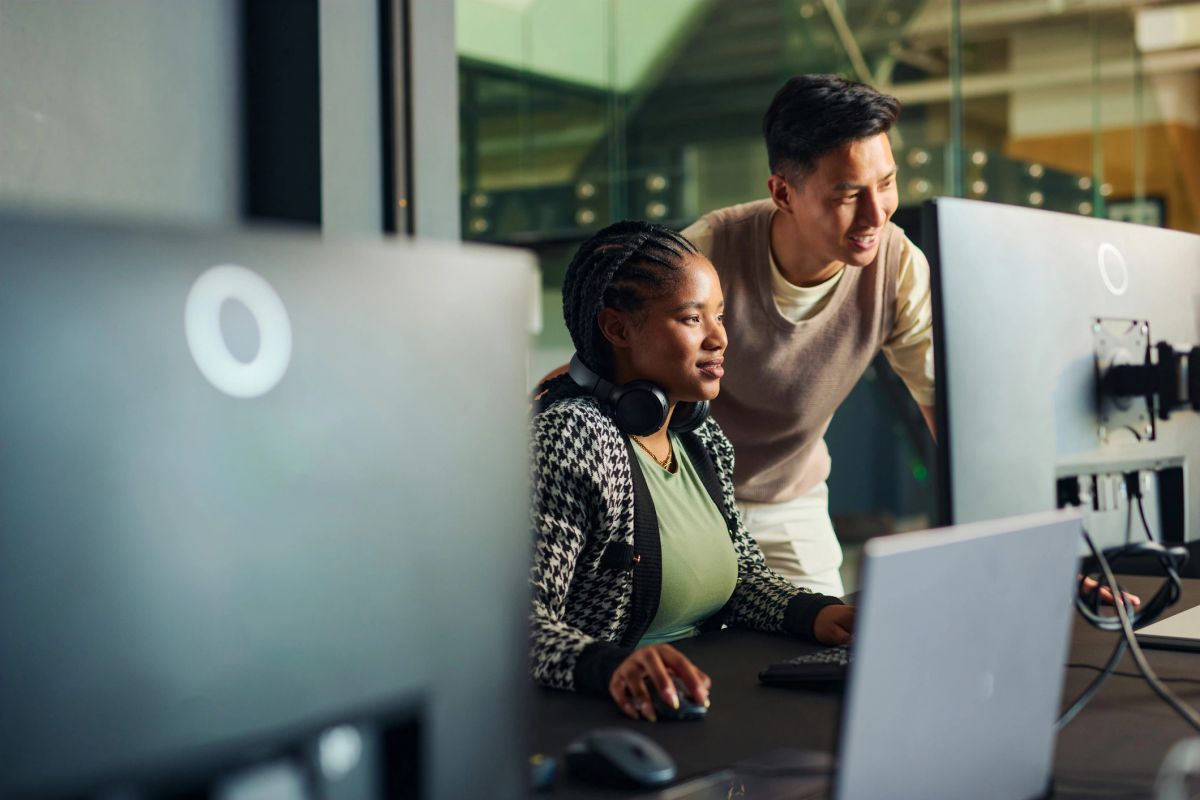 Two people working together at a computer